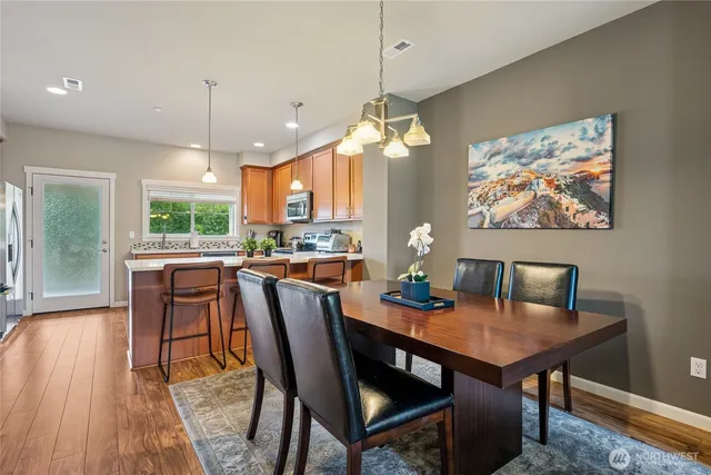 a view of a dining room with furniture window and wooden floor