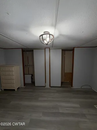 a view of a livingroom with wooden floor