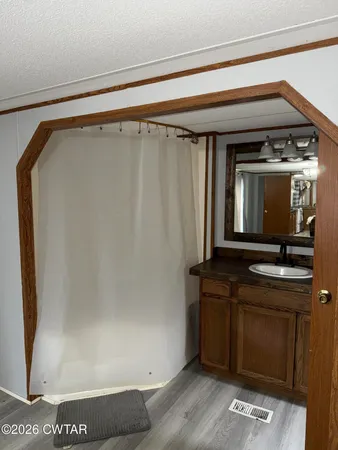 a kitchen with a refrigerator and a sink