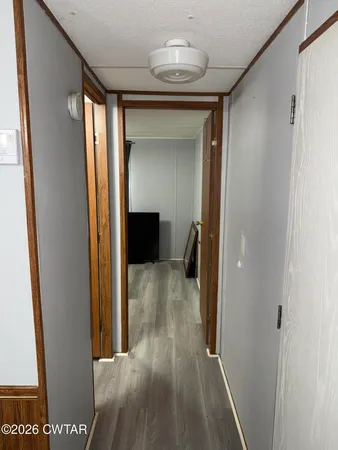 a view of gallery with wooden floor