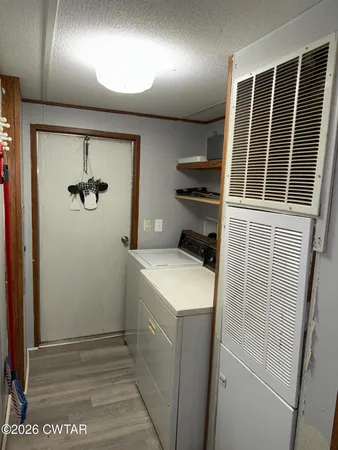 a view of hallway with washer and dryer