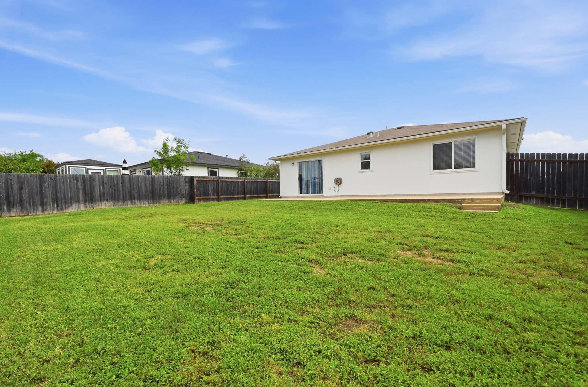 112 Mason Reed Cove Kyle, TX 78640 - Photo 24 of 26 a view of a house with a yard and sitting area