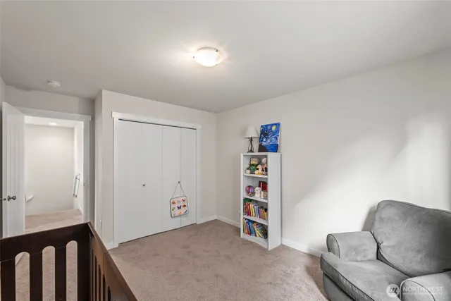 a view of livingroom with furniture and closet