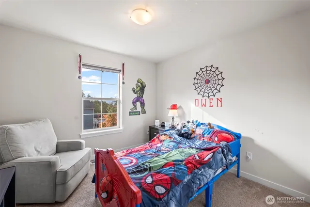 a bedroom with a bed and a table