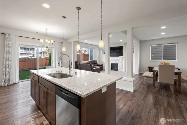 a large kitchen with a table and chairs