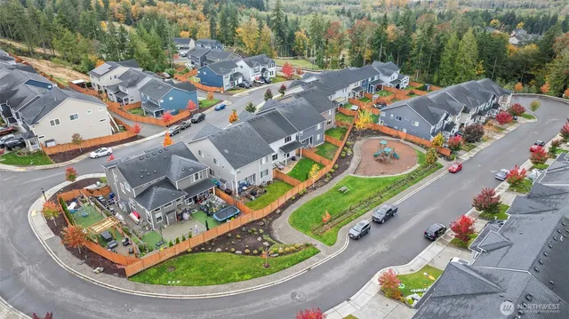 aerial view of a swimming pool with a patio