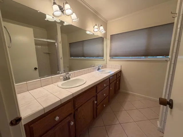 a kitchen with a sink cabinets and utility