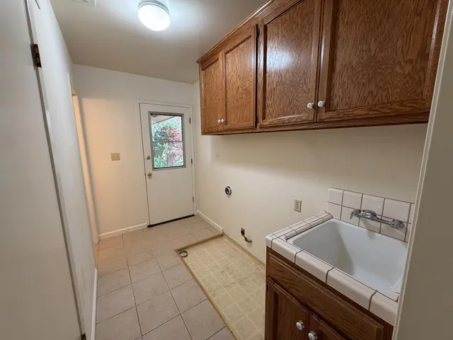 a backyard of a house with lots of green space and garden