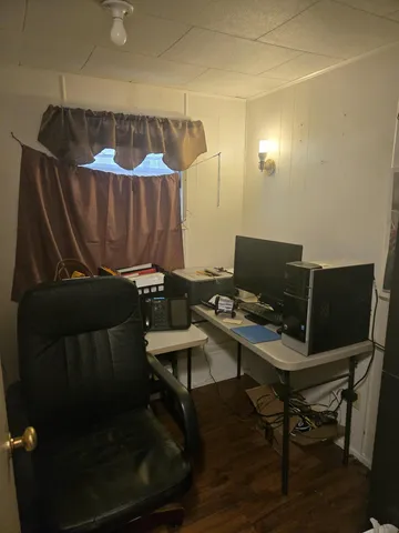 a view of a workspace with furniture