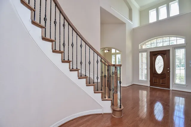 a view of an entryway with wooden floor