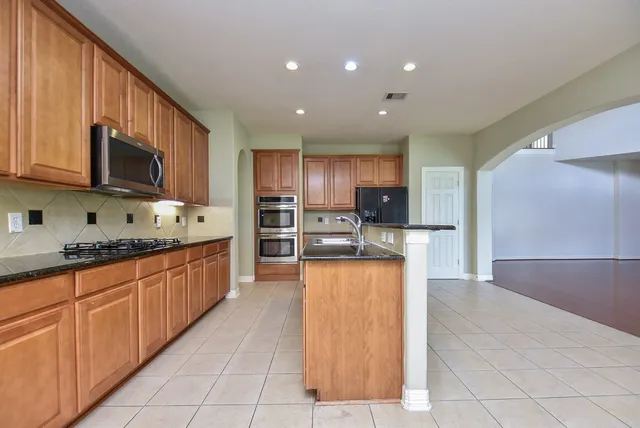 a large kitchen with cabinets