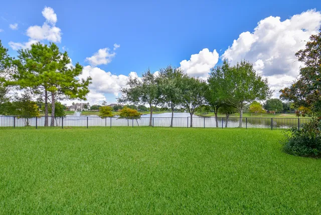 a view of a golf course with a lake