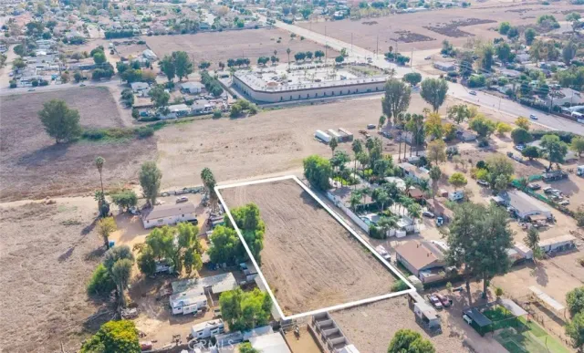 an aerial view of a residential houses with outdoor space