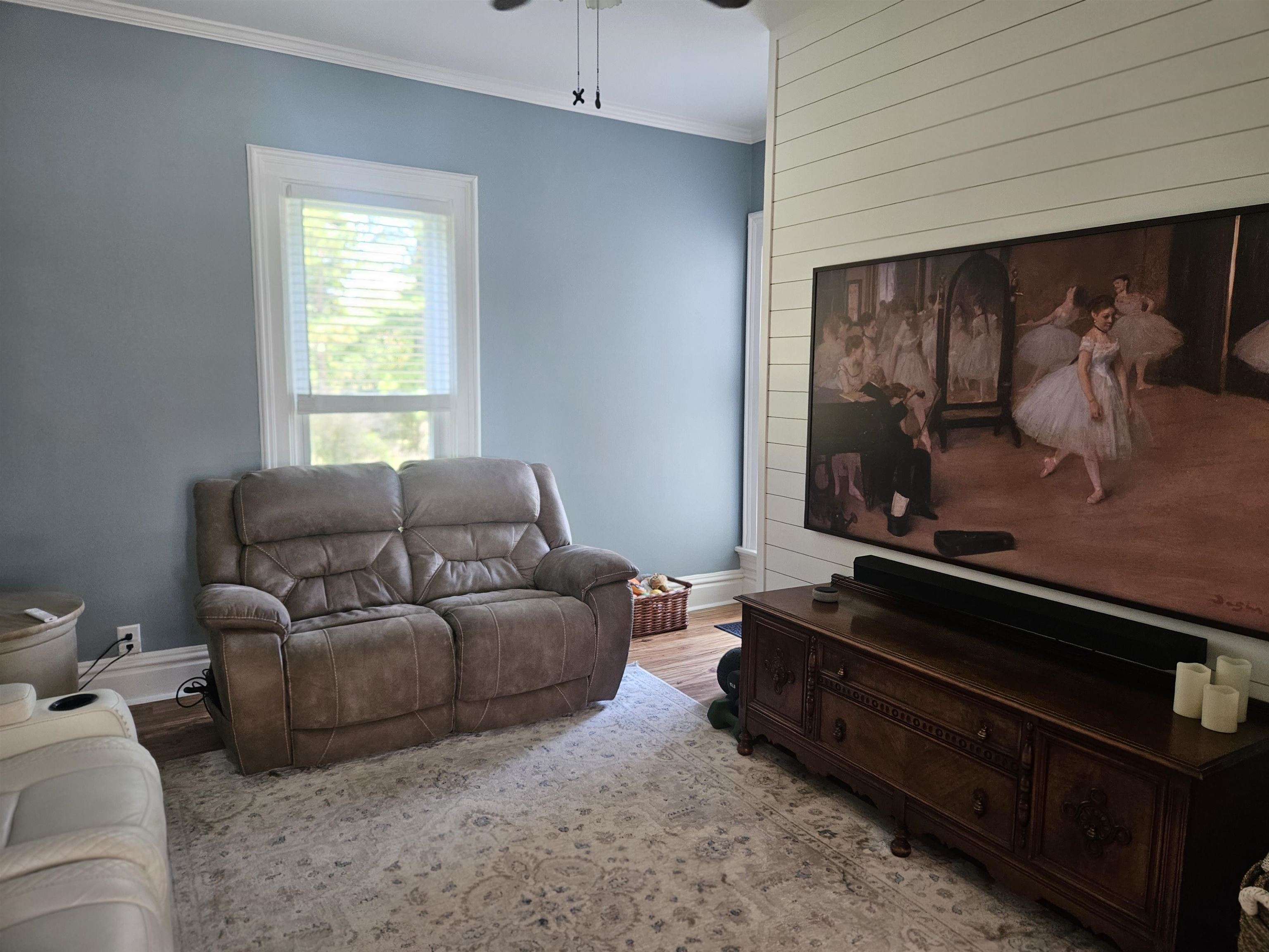 1851 West Winneshiek Road Freeport, IL 61032 - Photo 12 of 41 a living room with furniture a flat screen tv and a window