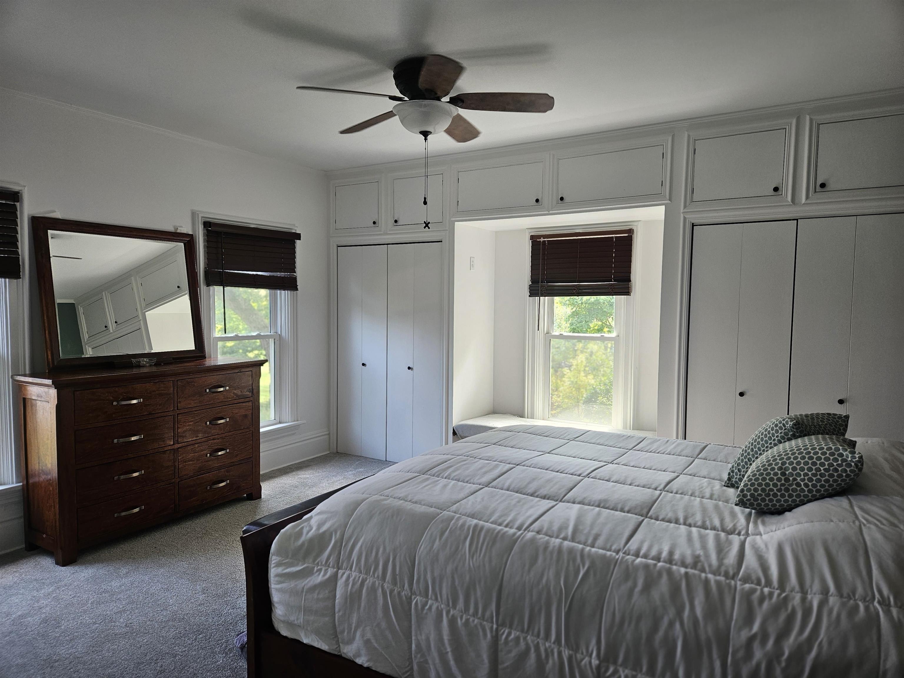 1851 West Winneshiek Road Freeport, IL 61032 - Photo 18 of 41 a bedroom with a bed and a dresser