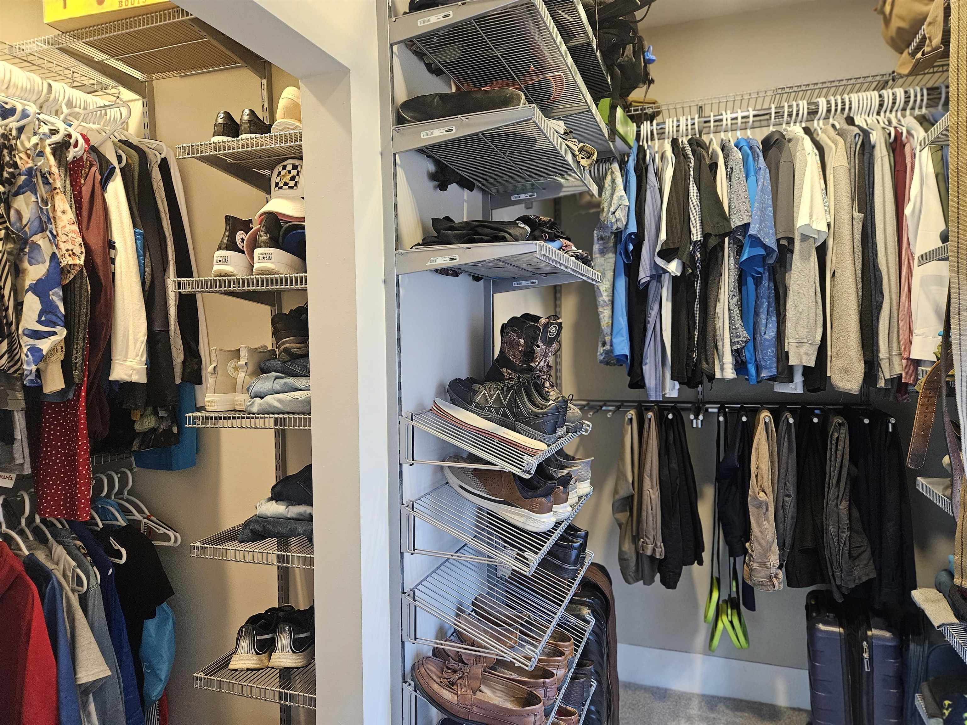 1851 West Winneshiek Road Freeport, IL 61032 - Photo 19 of 41 a view of walk in closet with clothes and shoes