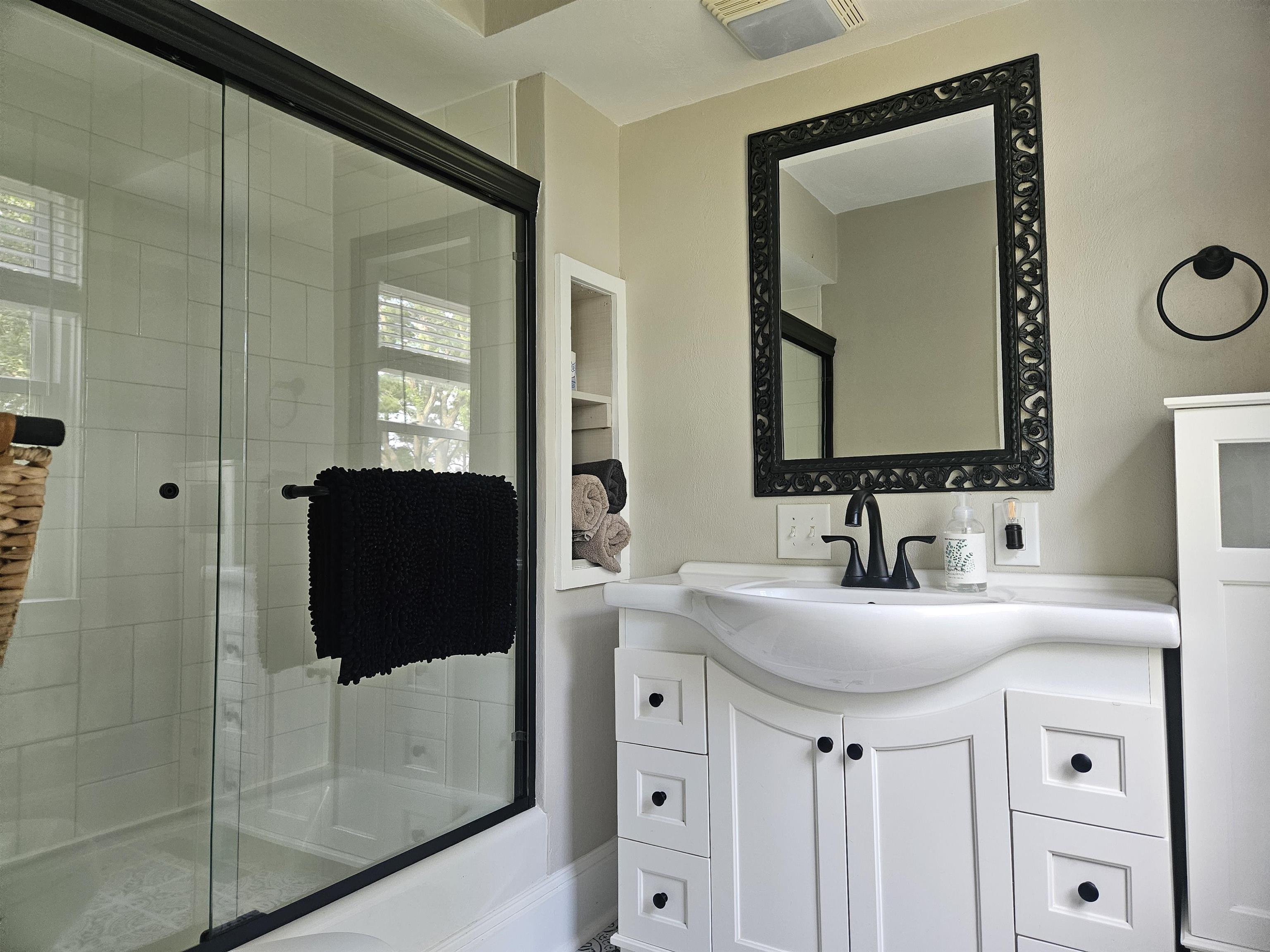 1851 West Winneshiek Road Freeport, IL 61032 - Photo 21 of 41 a bathroom with a double vanity sink and mirror