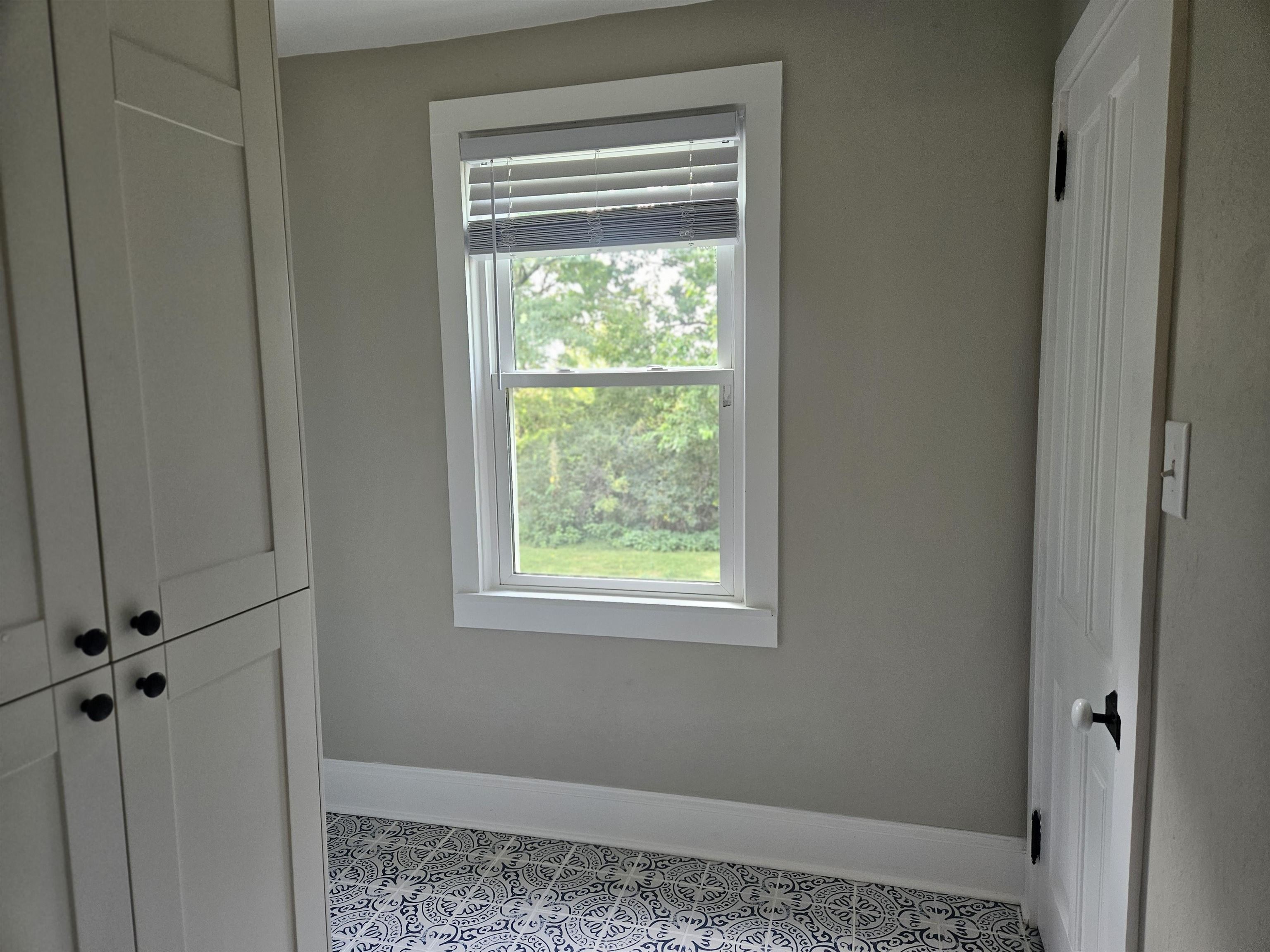 1851 West Winneshiek Road Freeport, IL 61032 - Photo 22 of 41 a view of an empty room and window