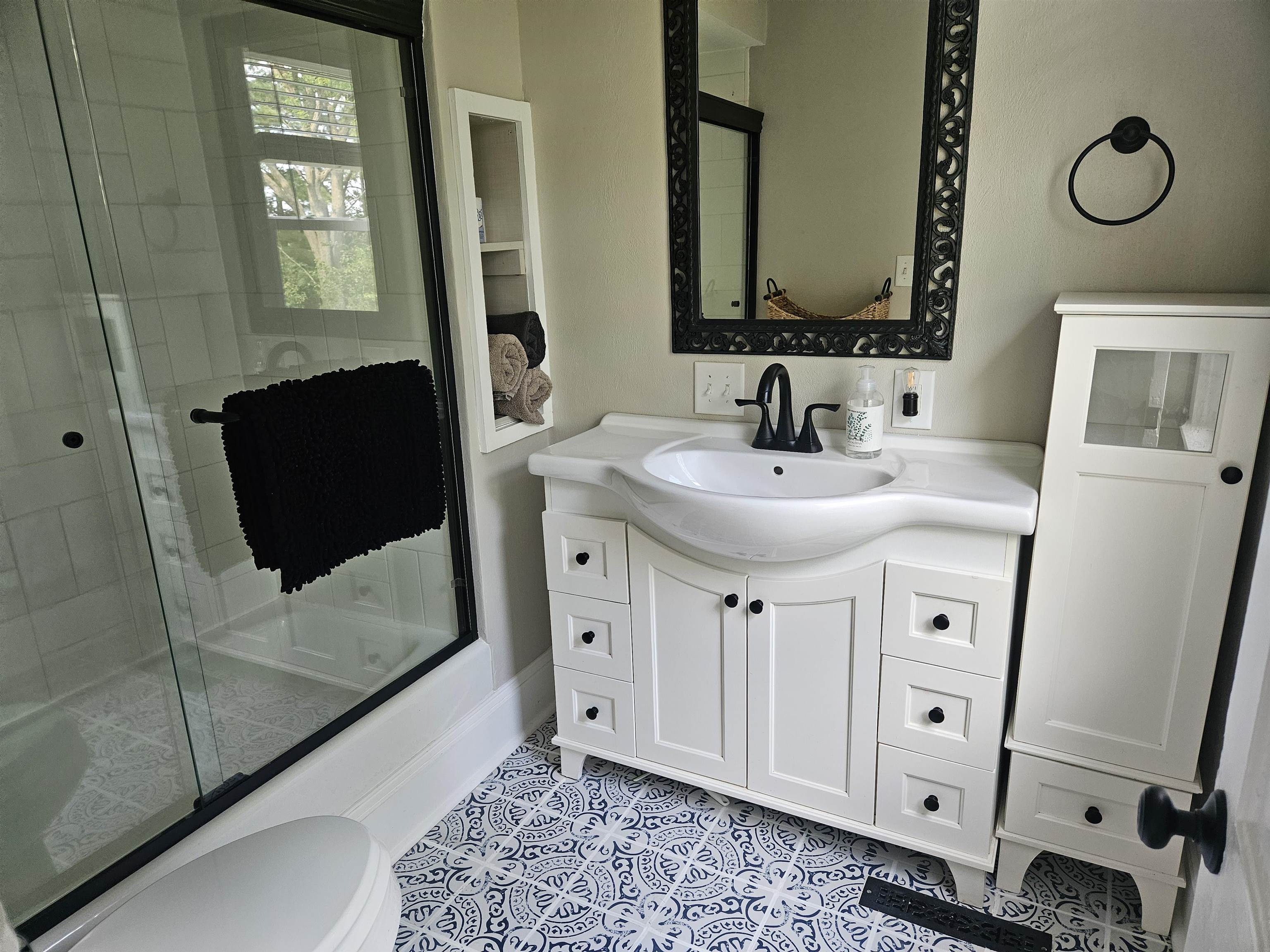 1851 West Winneshiek Road Freeport, IL 61032 - Photo 23 of 41 a spacious bathroom with a double vanity sink a mirror and shower