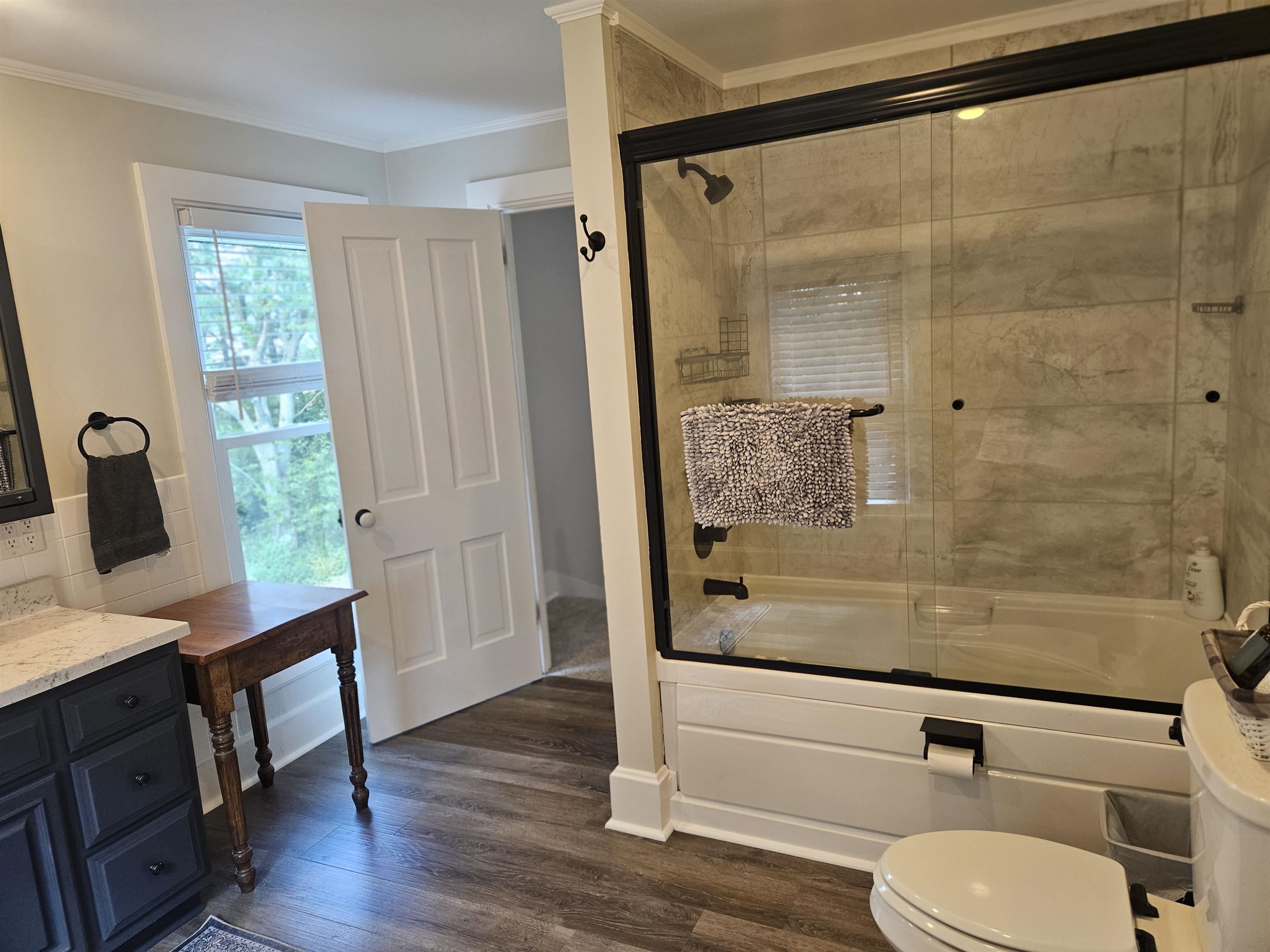 1851 West Winneshiek Road Freeport, IL 61032 - Photo 28 of 41 a bathroom with a granite countertop sink toilet and shower