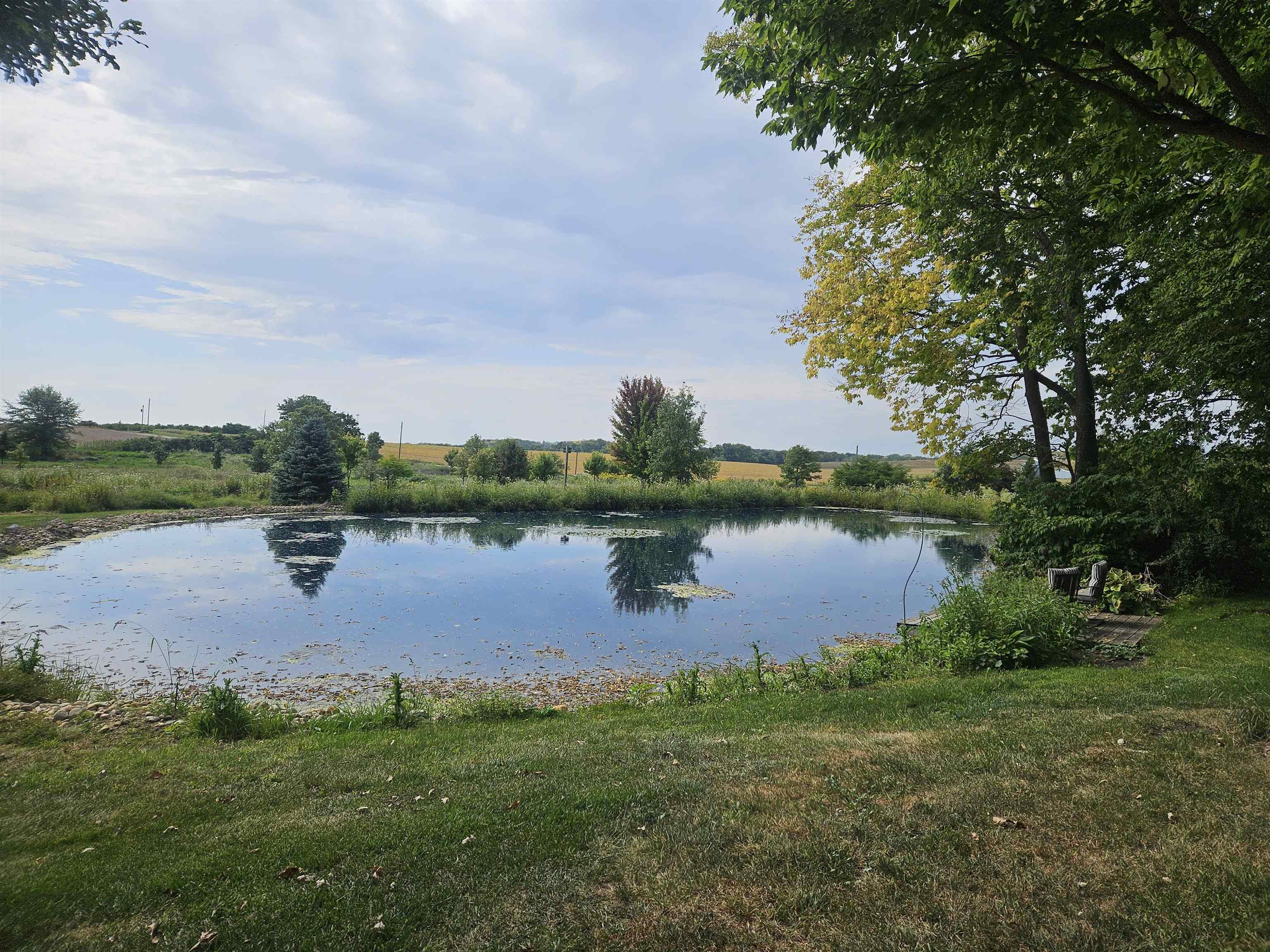 1851 West Winneshiek Road Freeport, IL 61032 - Photo 32 of 41 a view of a lake with houses in the back