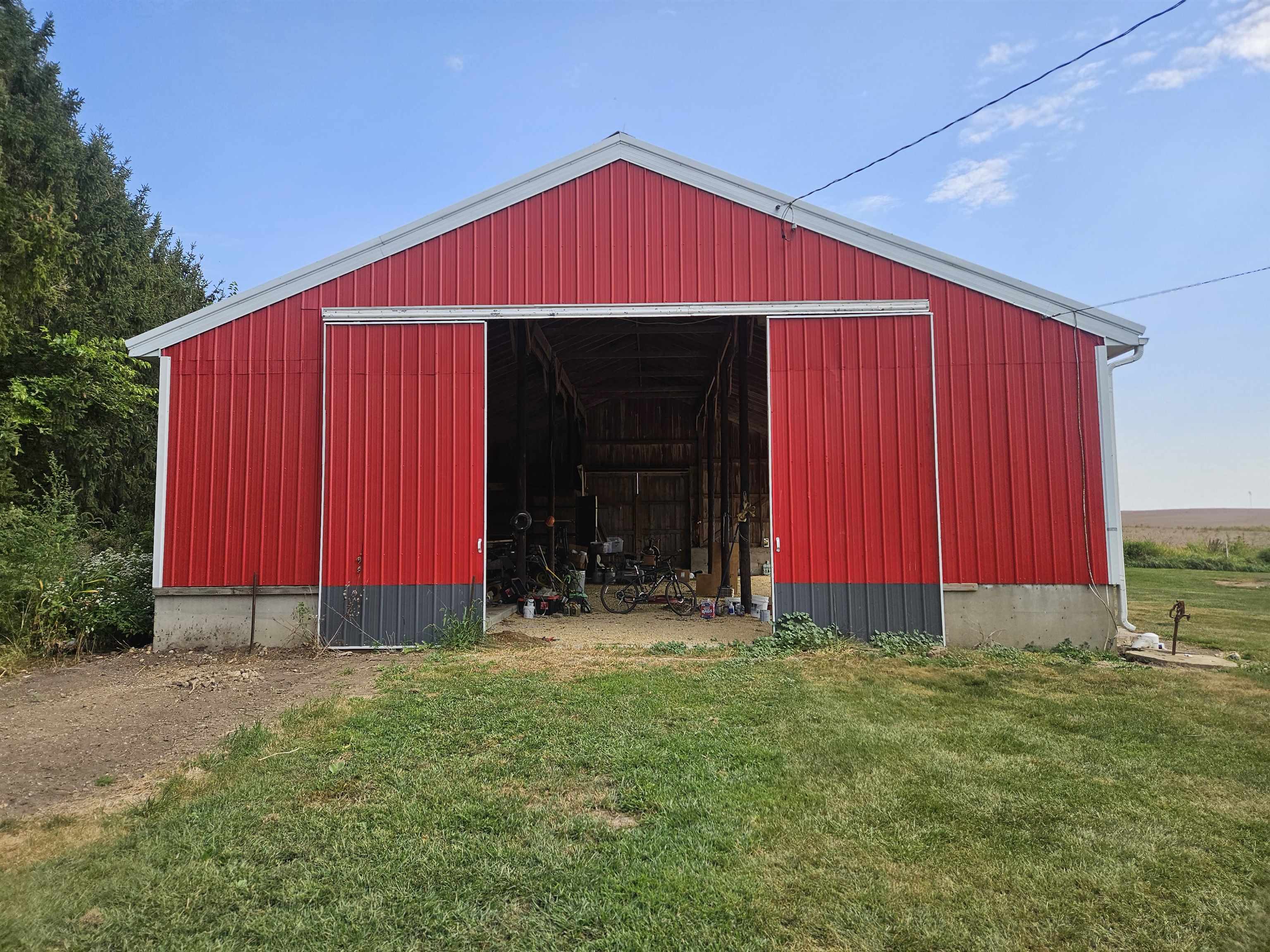 1851 West Winneshiek Road Freeport, IL 61032 - Photo 36 of 41 a view of barn with red umbrella