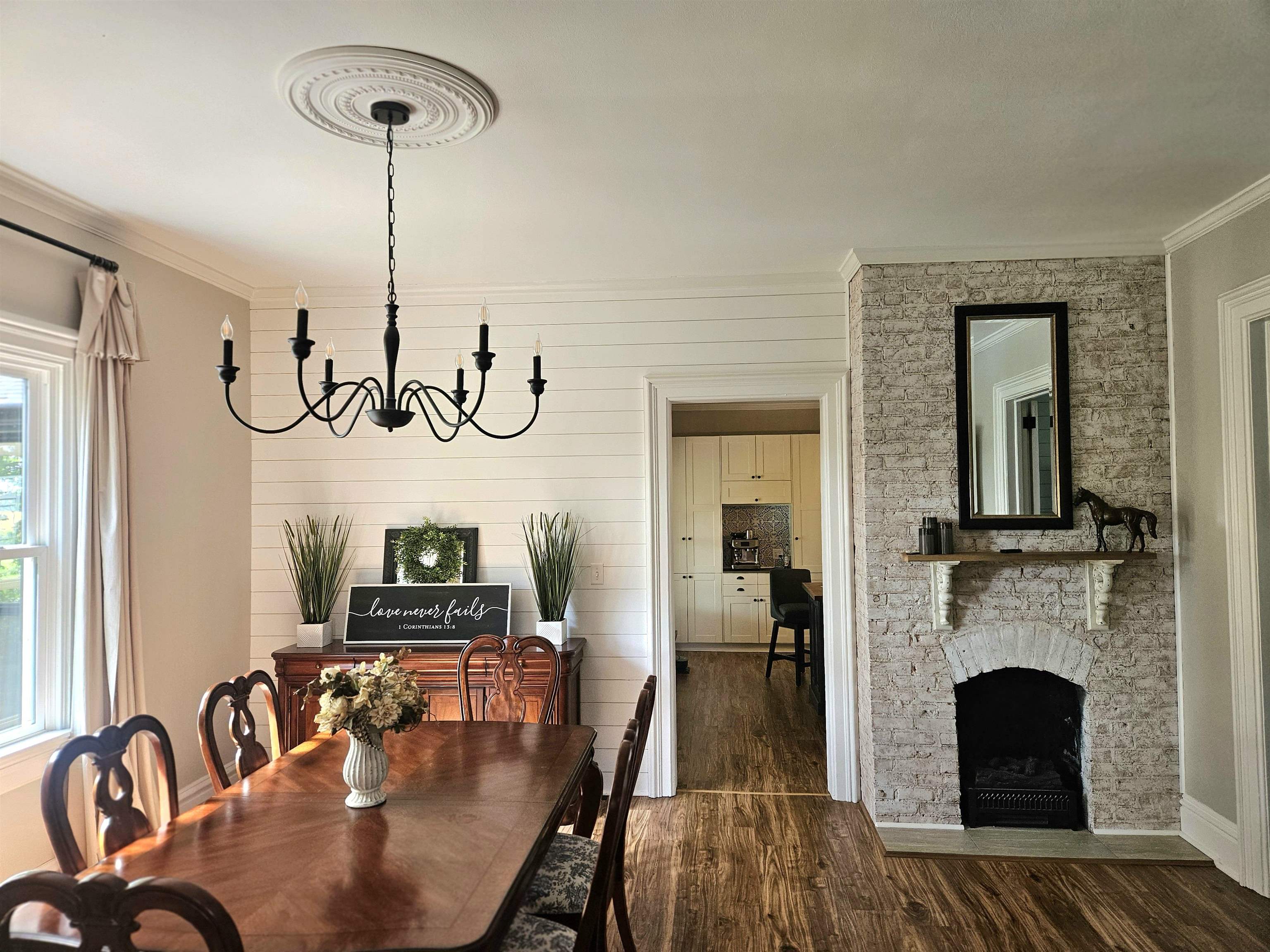 1851 West Winneshiek Road Freeport, IL 61032 - Photo 7 of 41 a view of a livingroom with furniture wooden floor a chandelier
