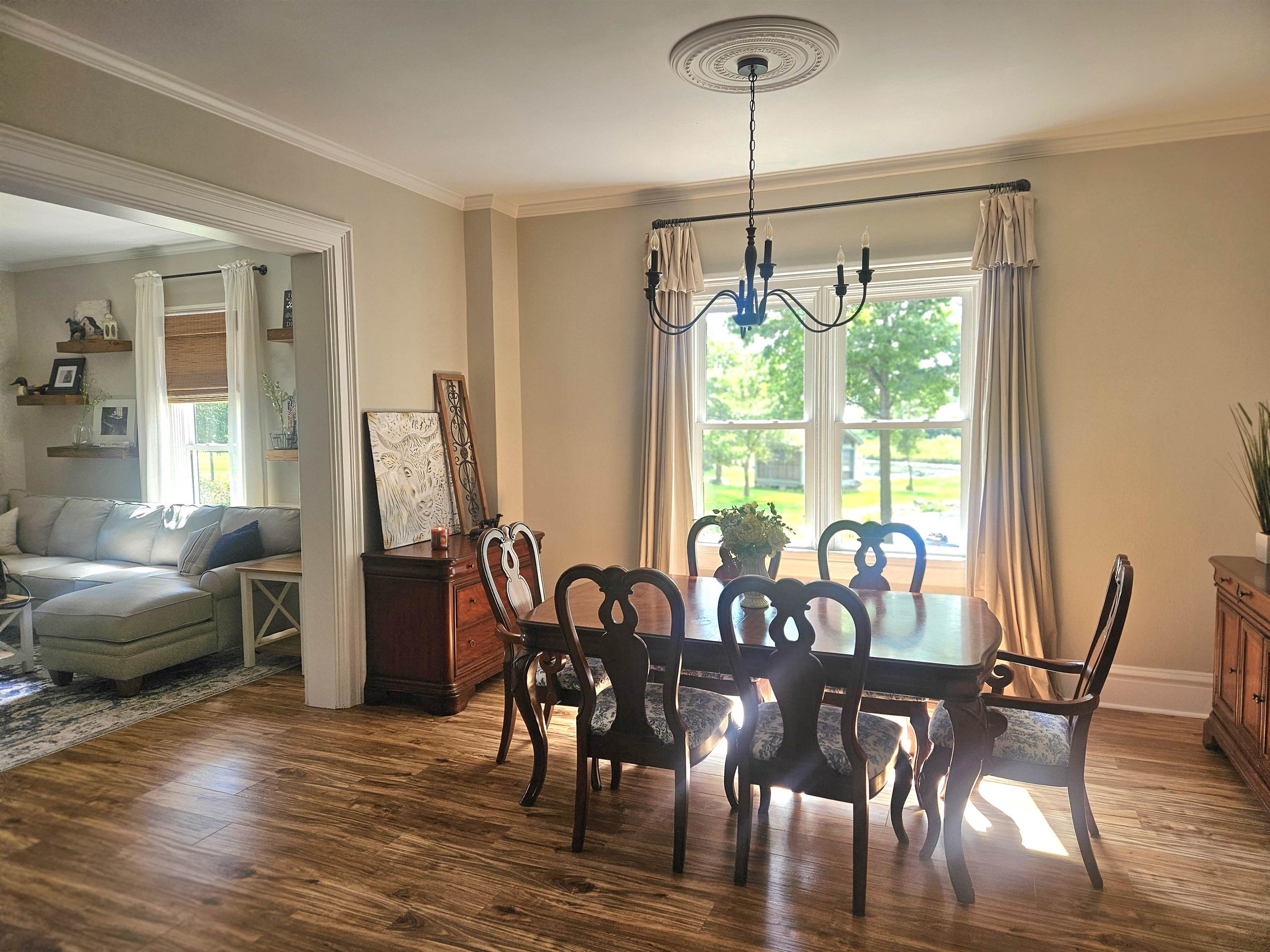 1851 West Winneshiek Road Freeport, IL 61032 - Photo 8 of 41 a view of a dining room with furniture window and wooden floor