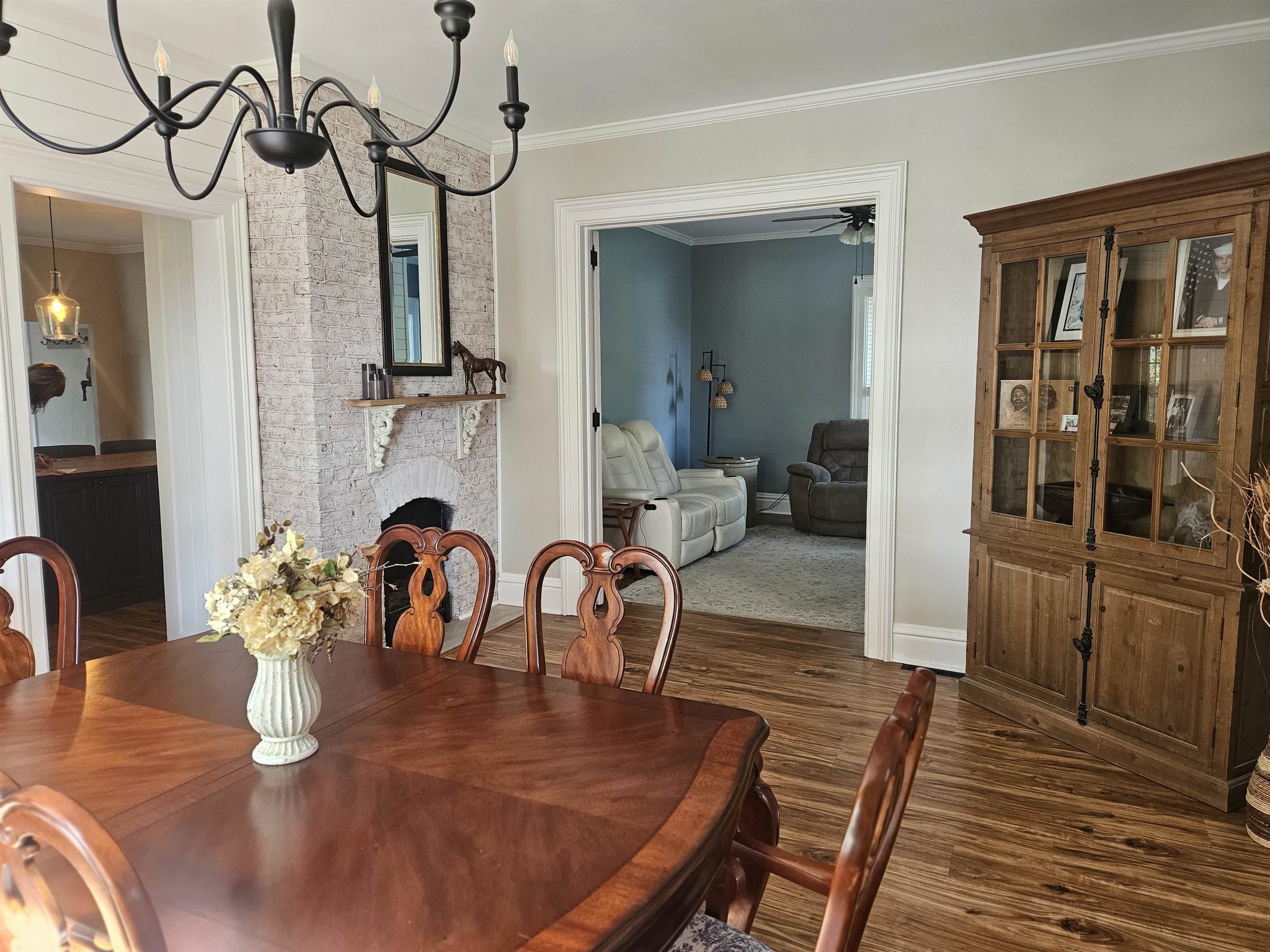1851 West Winneshiek Road Freeport, IL 61032 - Photo 9 of 41 a dining room with furniture a chandelier and wooden floor