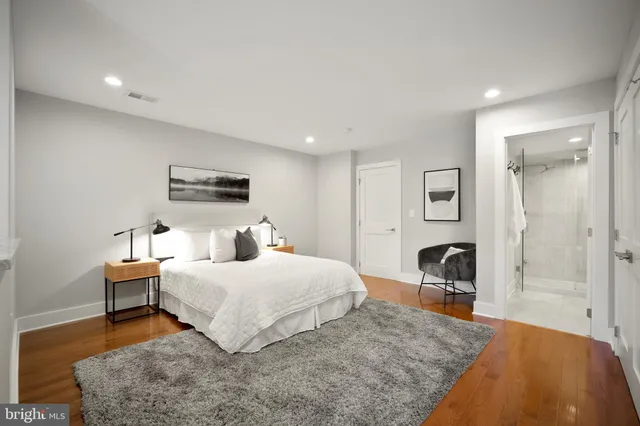 a bedroom with a bed and a couch