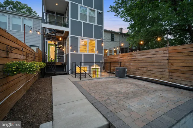 a view of a patio with table and chairs and potted plants