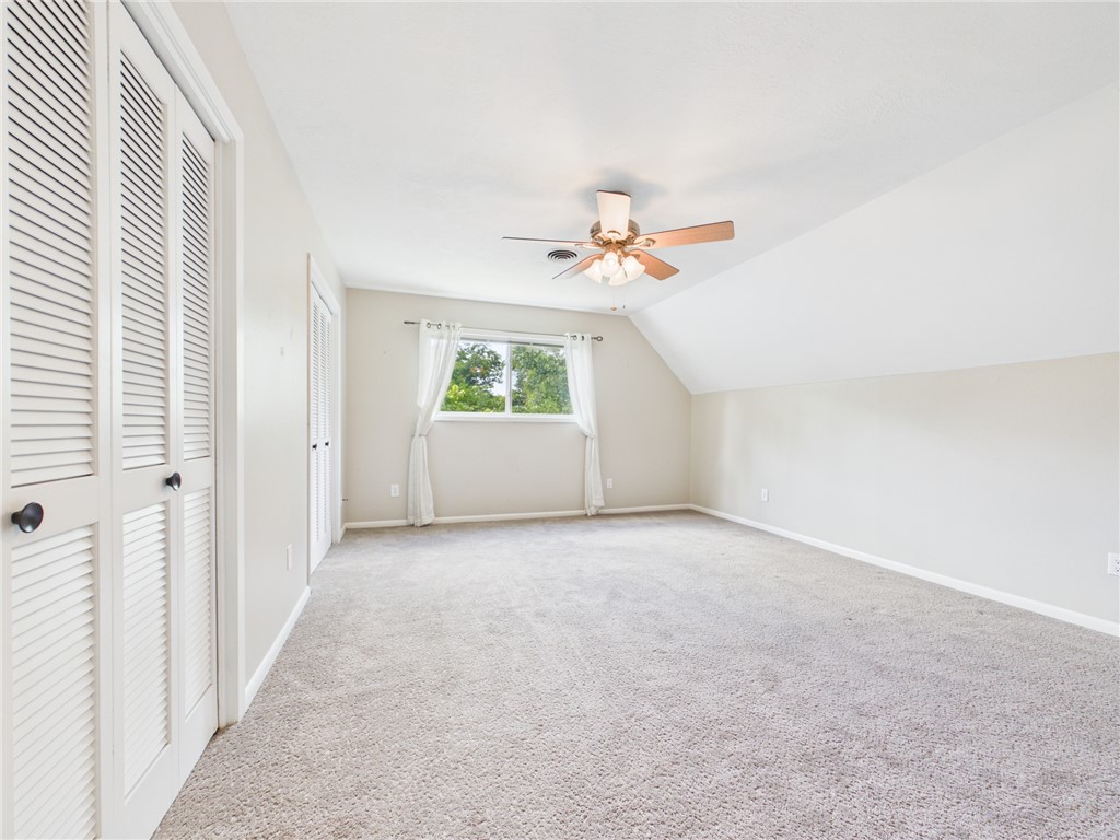 902 Briar Bend Court Bryan, TX 77802 - Photo 27 of 39 an empty room with windows and ceiling fan