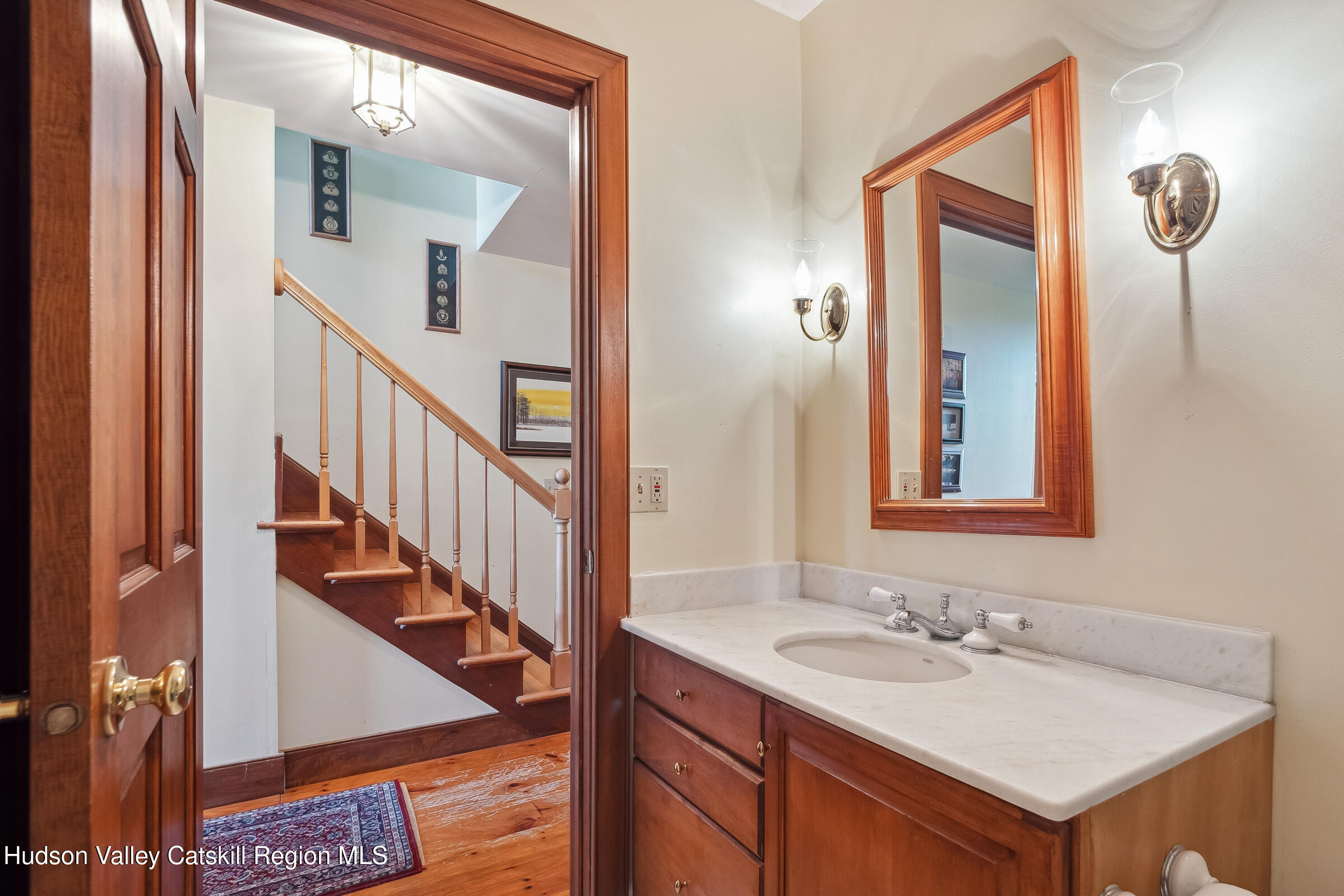 2205 County Rte 5 Canaan, NY 12029 - Photo 16 of 45 a bathroom with a sink and a mirror