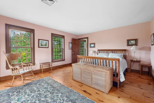 a bedroom with furniture and a window