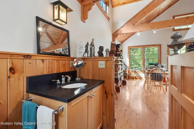a dining room with furniture and wooden floor