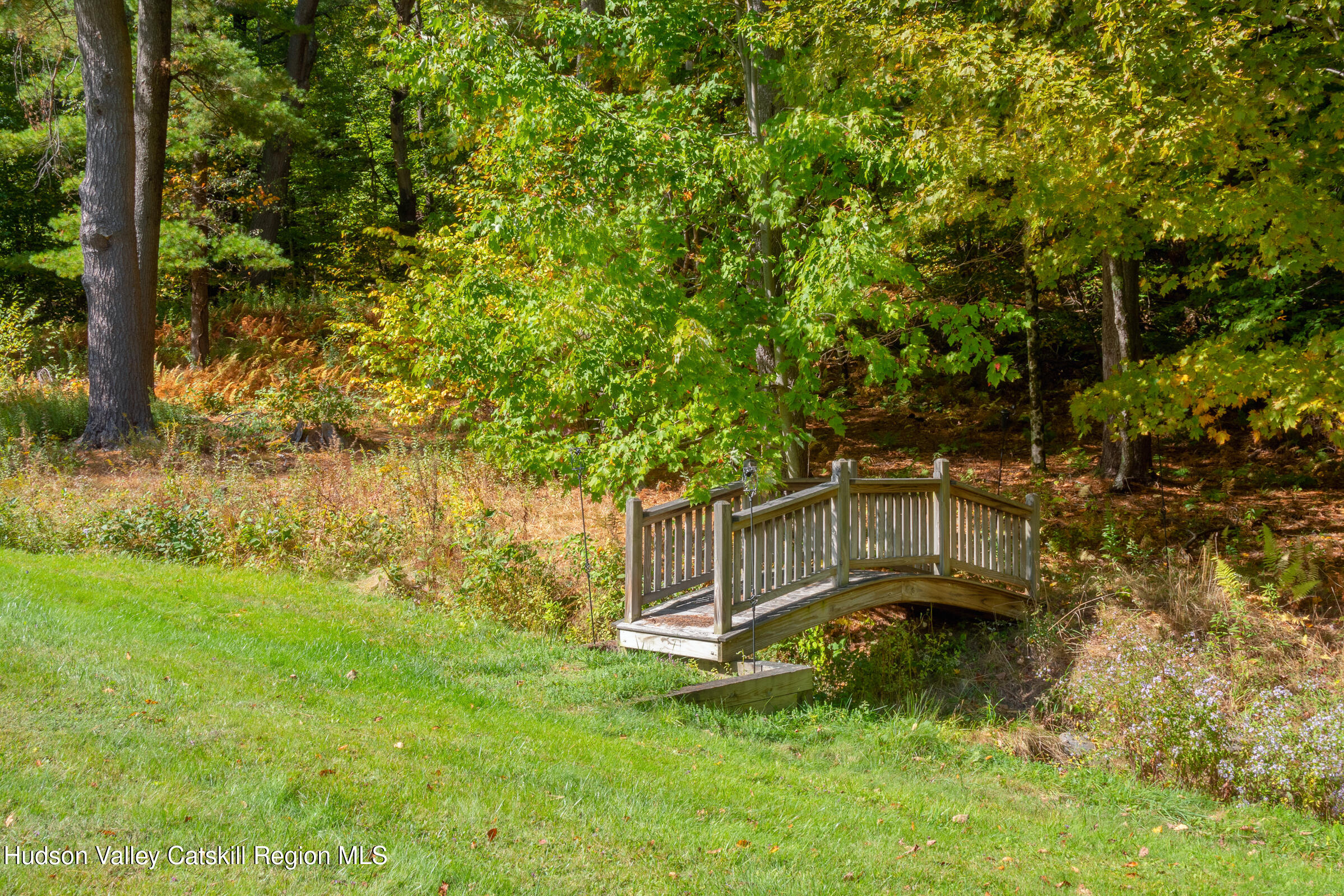 2205 County Rte 5 Canaan, NY 12029 - Photo 39 of 45 a view of a backyard with lawn chairs and a large tree
