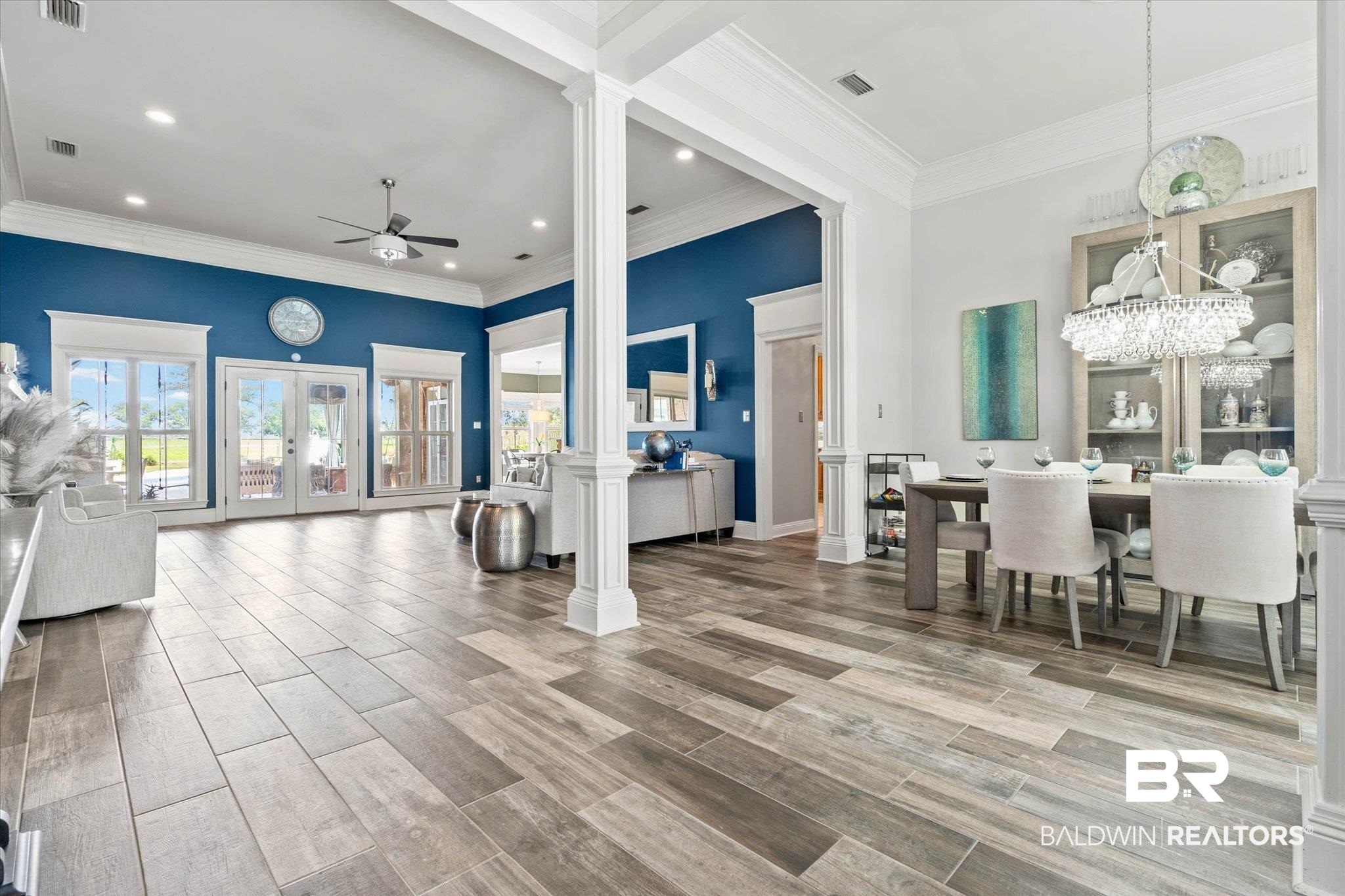 24908 Bosbyshell Avenue Daphne, AL 36526 - Photo 19 of 49 Open concept living space featuring wood-finish flooring, column accents, recessed lighting, and crown molding