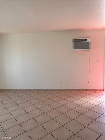 a kitchen with a refrigerator and a stove