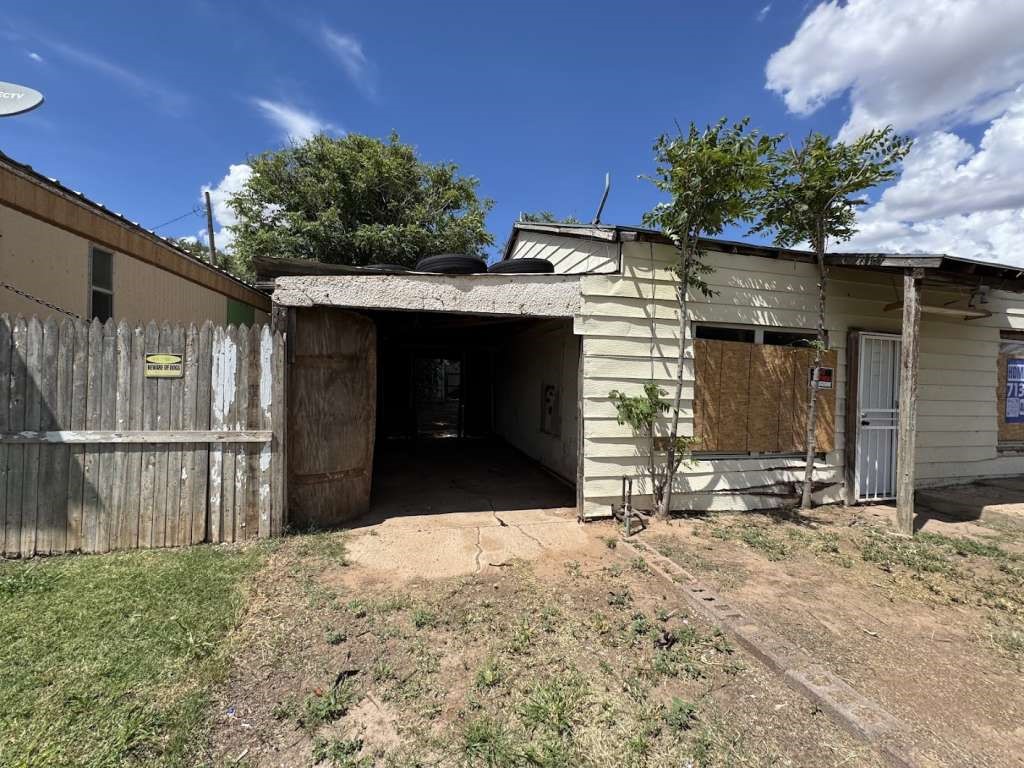 113 Maple Street Levelland, TX 79336 - Photo 2 of 6 a front view of a house with a yard