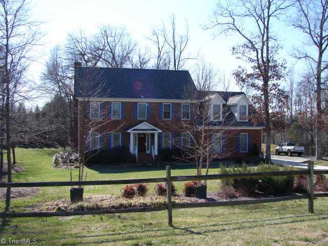 6706 Currieton Drive Oak Ridge, NC 27310 - Photo 1 of 9 Exterior Front.