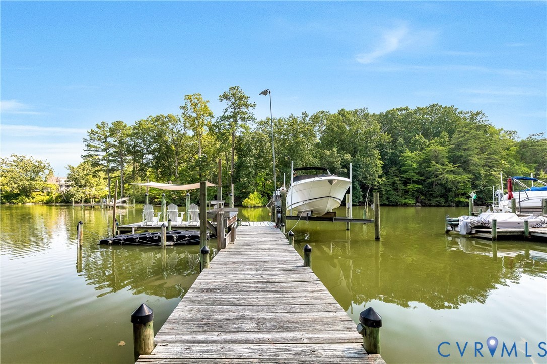 200 Pond Road Lancaster, VA 22503 - Photo 13 of 48 a view of a lake with house