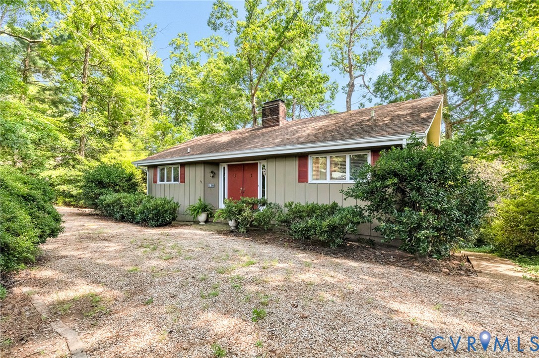200 Pond Road Lancaster, VA 22503 - Photo 17 of 48 a front view of a house with a garden