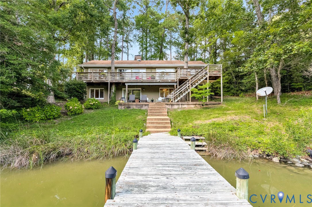 200 Pond Road Lancaster, VA 22503 - Photo 2 of 48 a view of a house with a yard