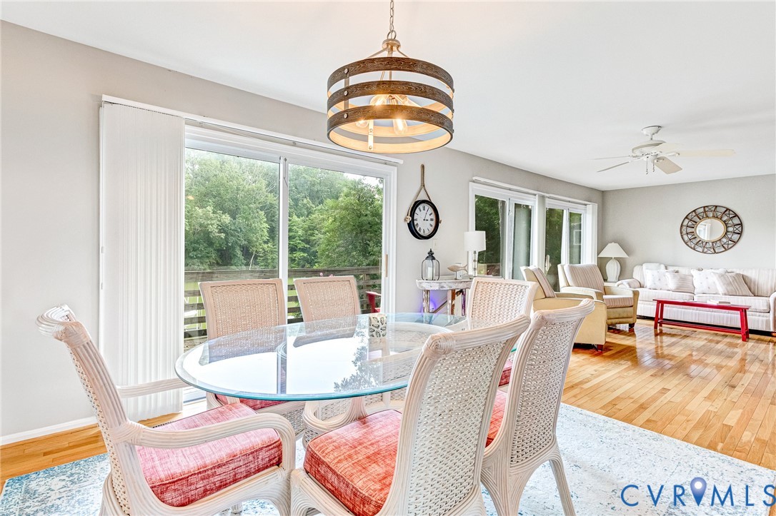 200 Pond Road Lancaster, VA 22503 - Photo 25 of 48 a living room with patio furniture and a large window