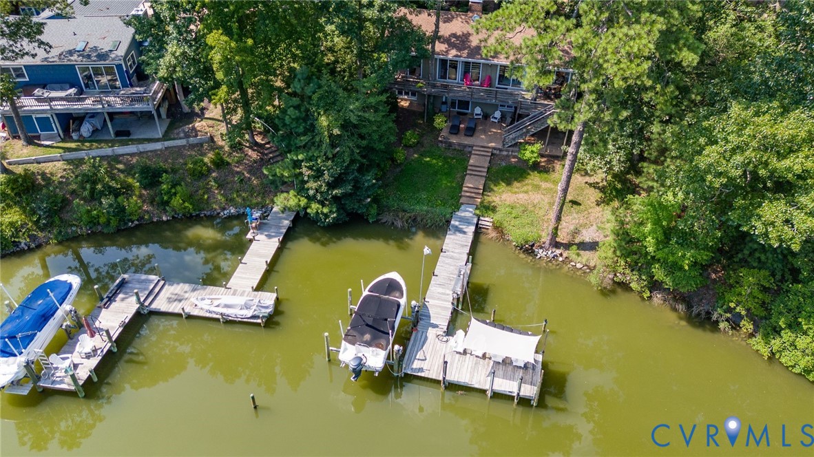 200 Pond Road Lancaster, VA 22503 - Photo 3 of 48 an aerial view of a house with swimming pool and outdoor seating