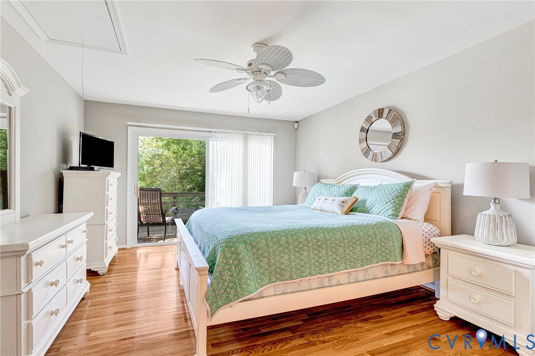 200 Pond Road Lancaster, VA 22503 - Photo 33 of 48 a bedroom with a large bed and a window