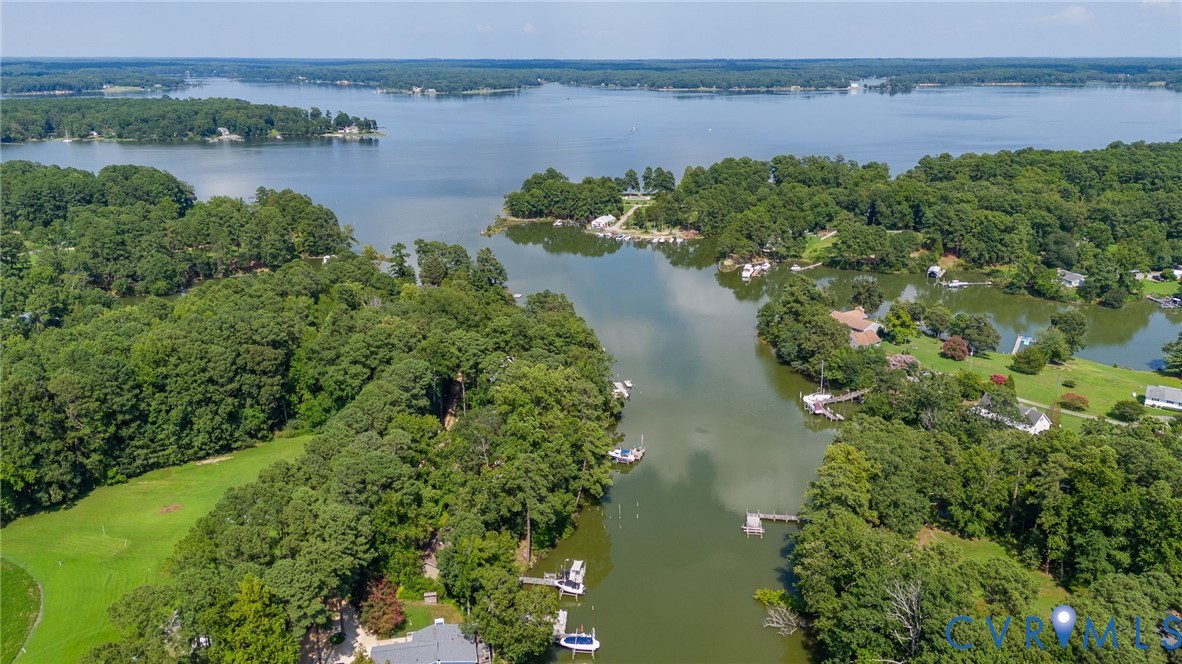 200 Pond Road Lancaster, VA 22503 - Photo 5 of 48 a view of a lake with beach and mountain view