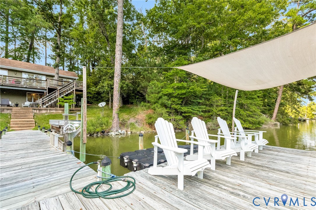 200 Pond Road Lancaster, VA 22503 - Photo 9 of 48 a view of deck with furniture and garden