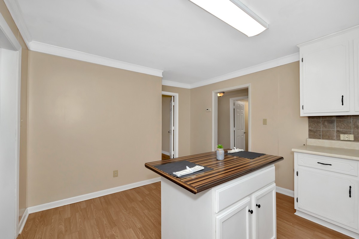 16871 New Cut Road Athens, AL 35614 - Photo 16 of 40 a kitchen with a sink and cabinets