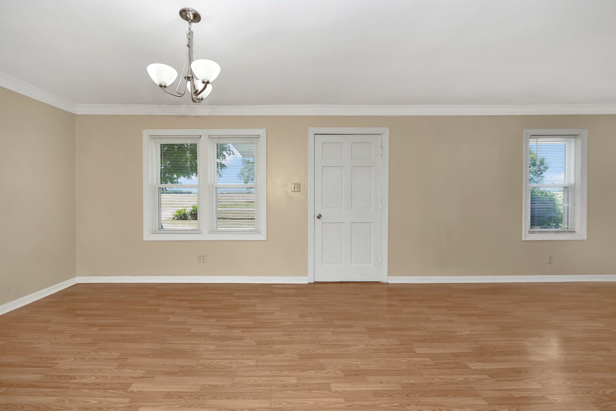 16871 New Cut Road Athens, AL 35614 - Photo 2 of 40 a view of wooden floor and windows in a room
